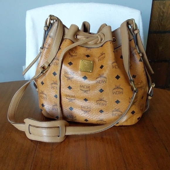 MCM Handbags - MCM Cognac Bucket Bag with Signature Visetos Print